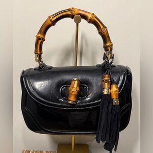 Gucci 
Bamboo 1947


•Black Leather
• Bamboo Accent
• Bamboo Handle